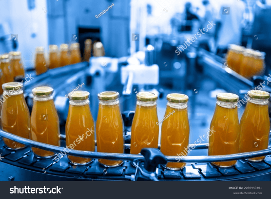 stock-photo-factory-interior-of-beverage-production-line-of-manufacturing-and-packaging-juice-products-close-2036949461 1
